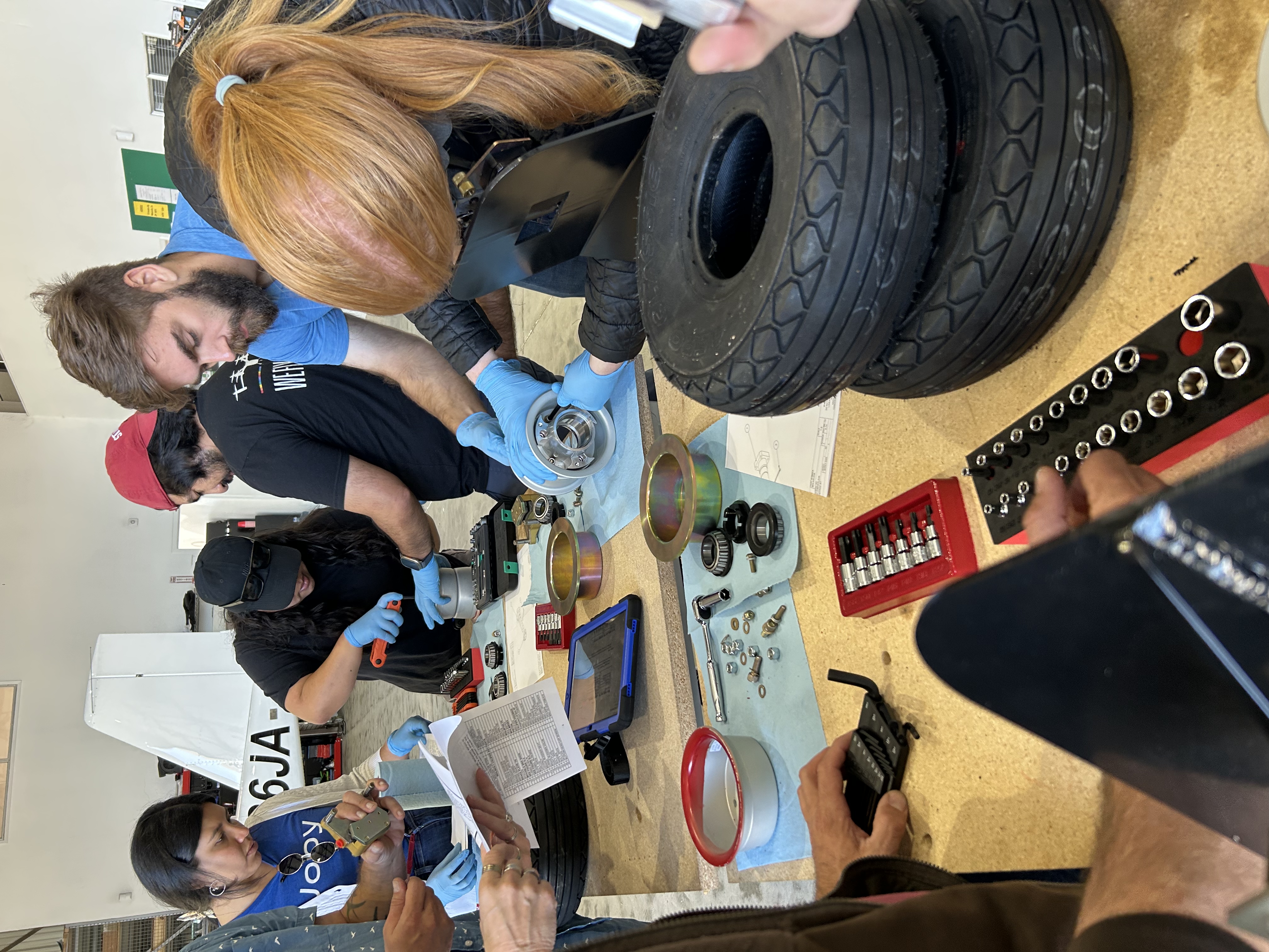 Trainees assembling landing gear systems